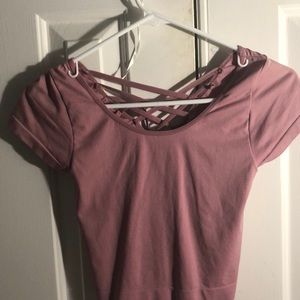 pink crop top with crosses in the back